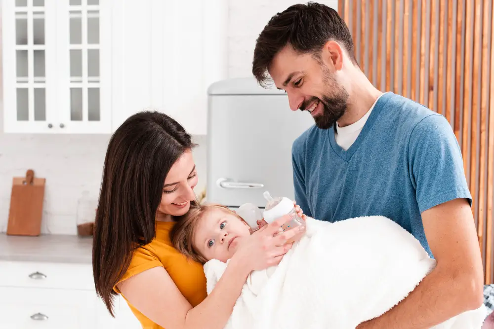 A happy intended parent couple holding their newborn with the caption “Trusted Surrogacy4All Journey.