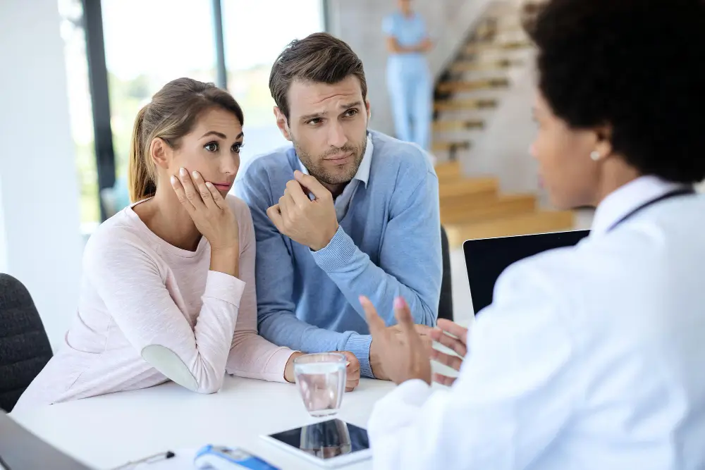Healthcare professionals, fertility specialists, and intended parents collaborating to coordinate IVF treatment, surrogate screening, prenatal care, and multidisciplinary support during a surrogacy journey.